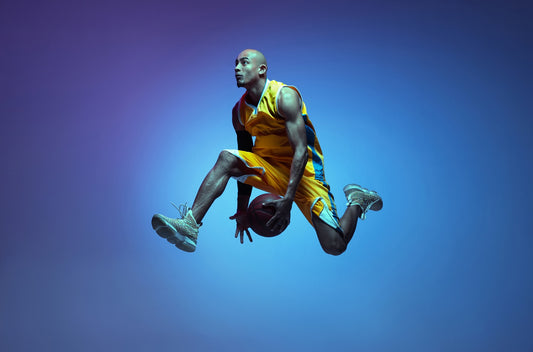  athletic african-american male basketball player training